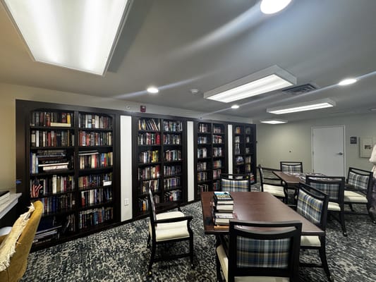 Interior view of a cozy library area with bookshelves