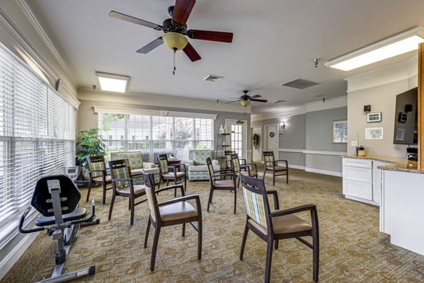 Common area with chairs and exercise equipment