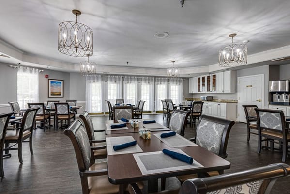 Dining area with tables set for residents
