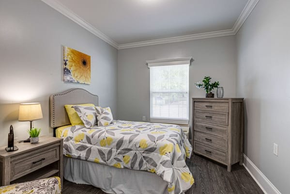 Cozy private room with floral bedding and natural light