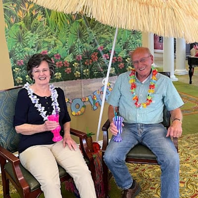 Residents enjoying a festive activity with drinks and decorations