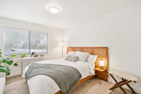 Bright, cozy private resident room with bed and decor