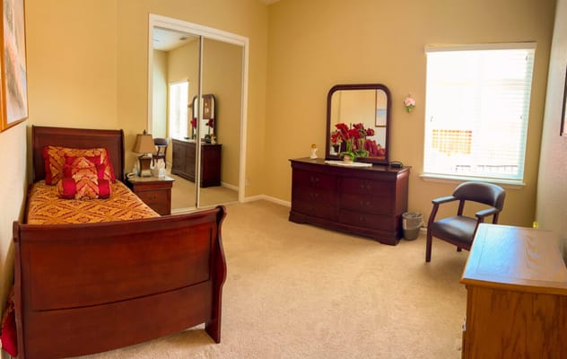 Cozy private room with a bed and dresser