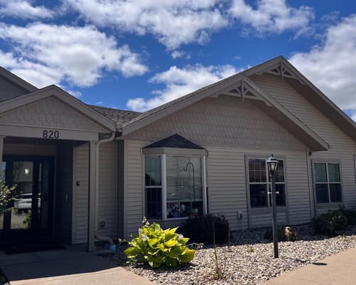 Exterior view of the nursing home building on a sunny day