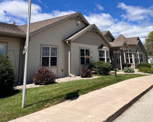 Exterior view of the assisted living facility with landscaping