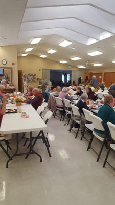 Residents enjoying a meal in a dining area