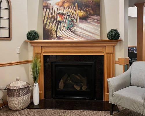 Cozy common area with fireplace and art