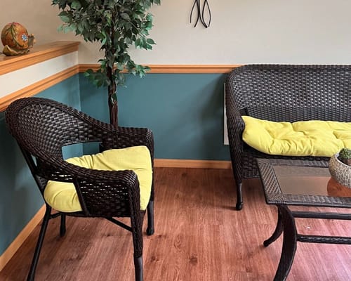 Seating area with wicker furniture and decor