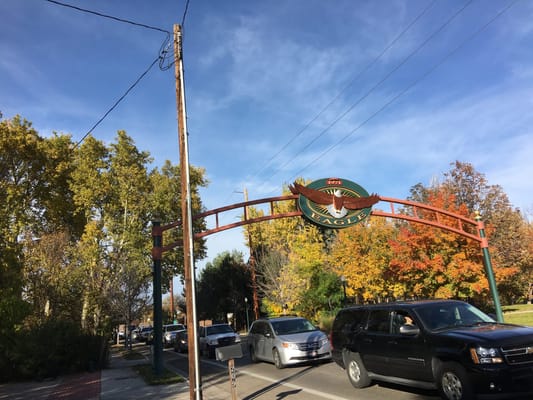 Entrance archway to the Eagle Senior Center with autumn trees