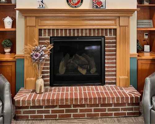 Cozy fireplace in a common area of the facility