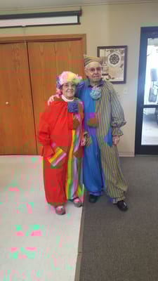 Two residents dressed as clowns in a common area