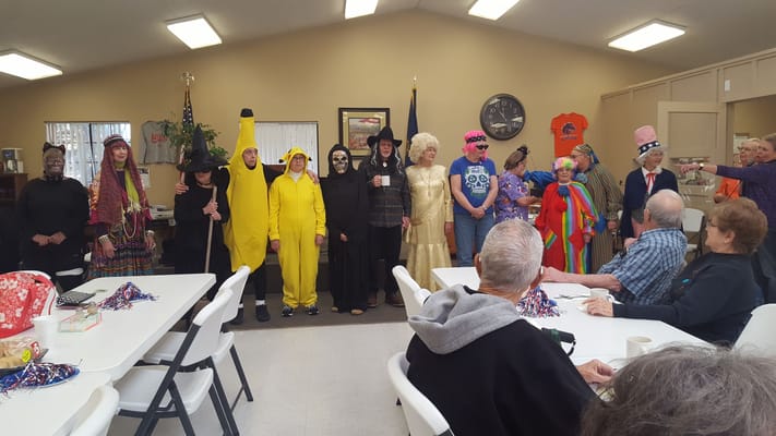 Residents in costumes during a lively event.