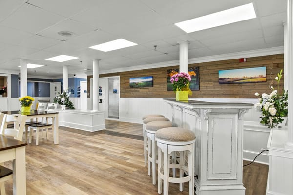 Bright common area with seating and flowers