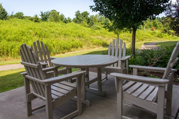 Outdoor seating area with chairs and table