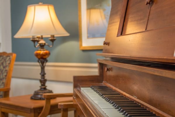 Close-up of a piano in a cozy interior space