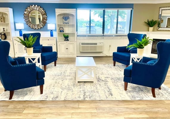 Cozy interior common area with blue seating