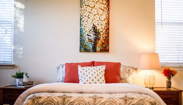 Cozy private bedroom with decorative painting