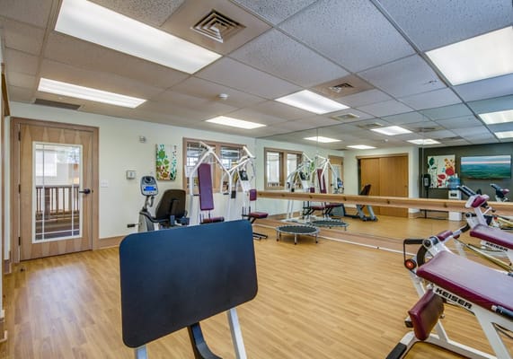 Physical therapy gym with exercise equipment