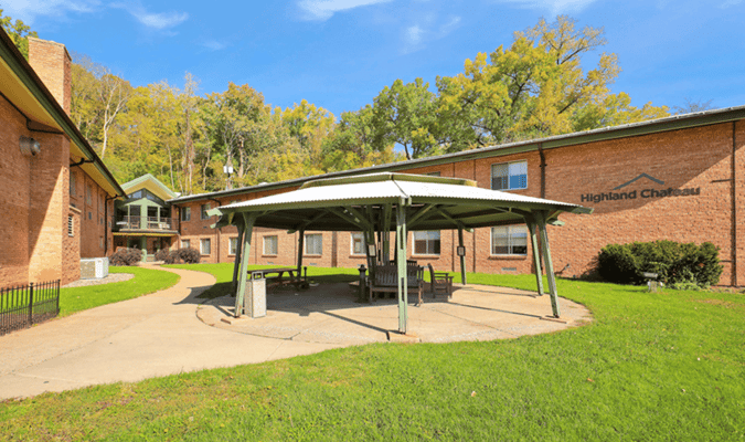 Exterior view of Highland Chateau with a gazebo in the yard