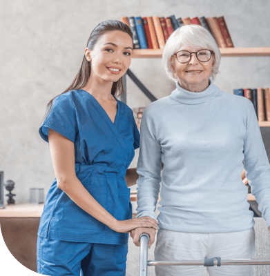 Staff member with a resident in a cozy interior