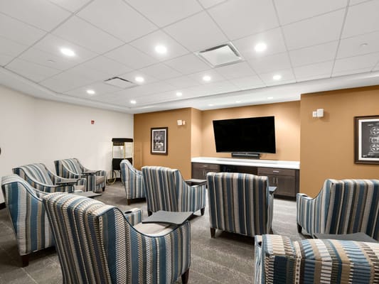Common area with comfortable seating and a television