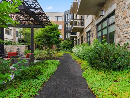 Pathway through a landscaped outdoor area of the facility
