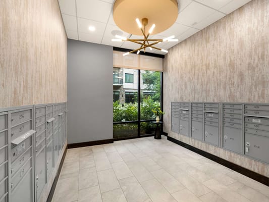 Mailroom with lockers and a view of the garden