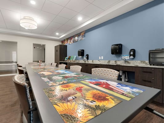 Activity room with puzzle tables and colorful decorations