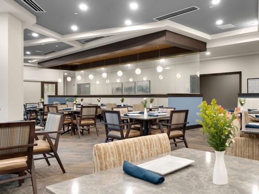 Bright dining room with tables and flower decorations