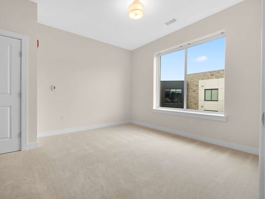 Bright empty resident room with a window view