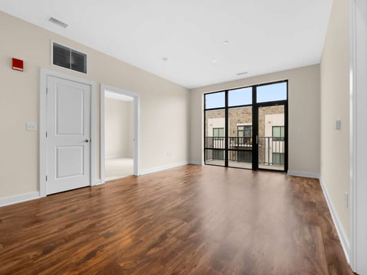 Spacious interior of a resident's room with large windows