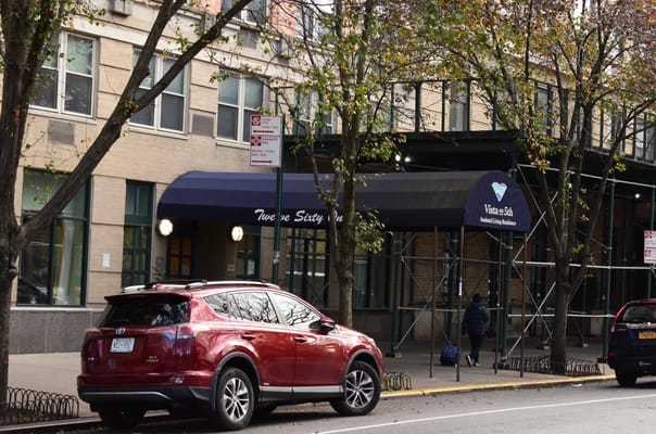 Front entrance of Vista on 5th with vehicle parked