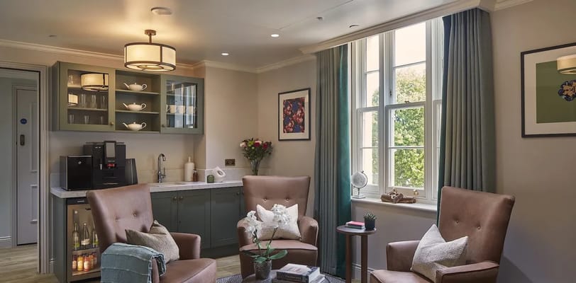 Cozy lounge area with comfortable seating and natural light