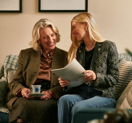 Residents enjoying a conversation in a cozy lounge