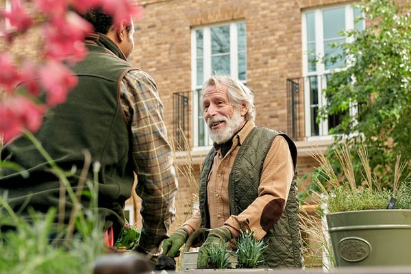Residents gardening in an outdoor area