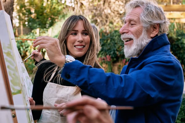 Residents participating in an art activity outdoors