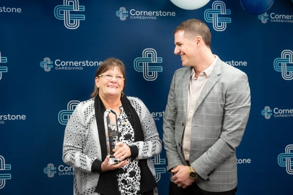 Residents celebrating with awards at a Cornerstone event
