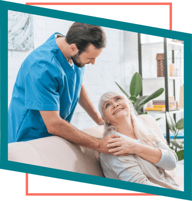 A caregiver assisting a resident in a cozy interior