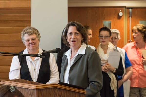 A speaker addressing a crowd during an event at the facility