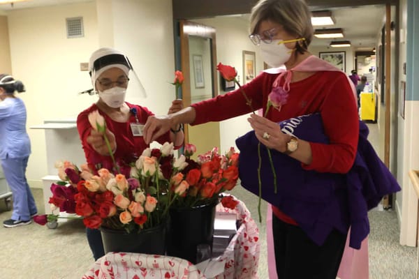 Residents arranging flowers in a common area