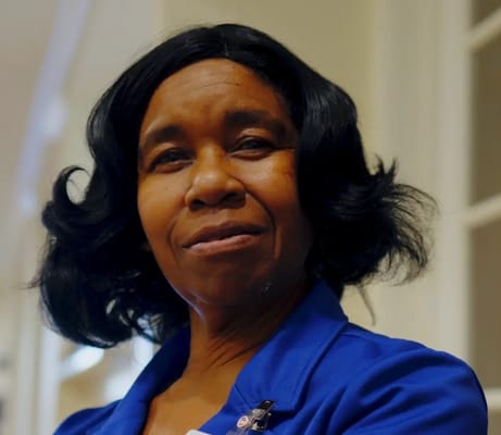 A staff member smiling in a care facility