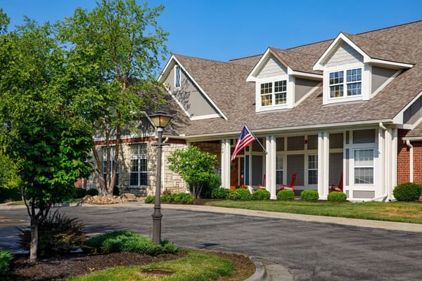 Exterior view of assisted living facility with landscaped entrance