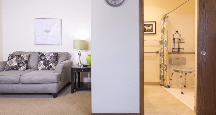 Cozy resident room with a couch and bathroom