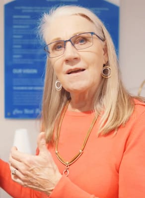 Resident engaging in conversation with staff member