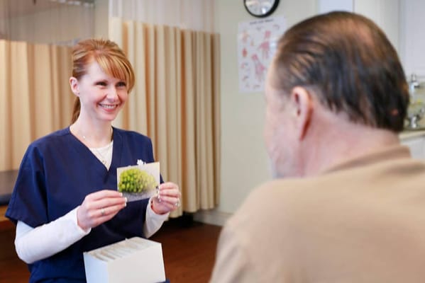 Staff member engaging with a resident in a common room