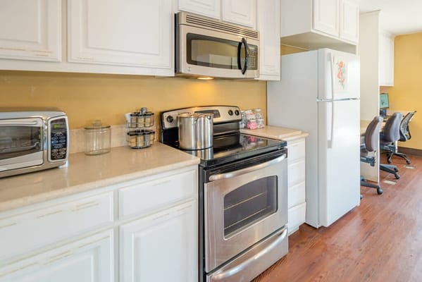 Kitchen area with appliances and workspace