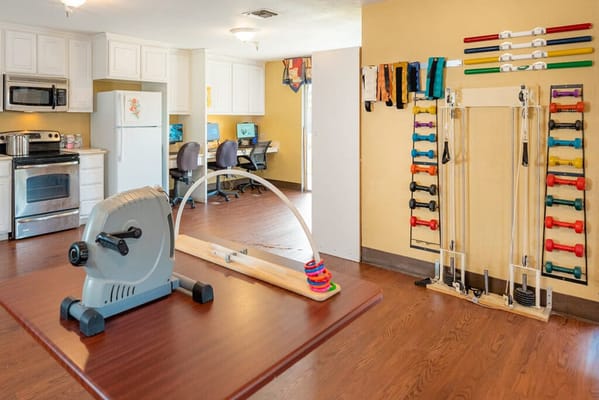Exercise equipment in a well-lit activity room