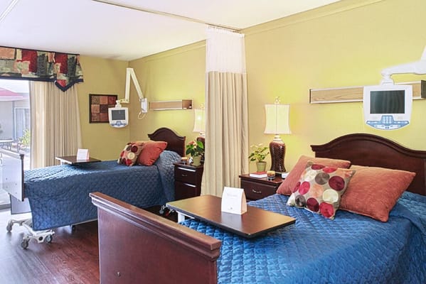 Interior view of a shared resident room with beds