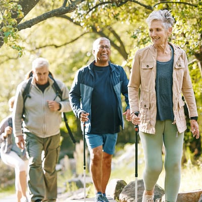 Residents enjoying a nature walk on a sunny day