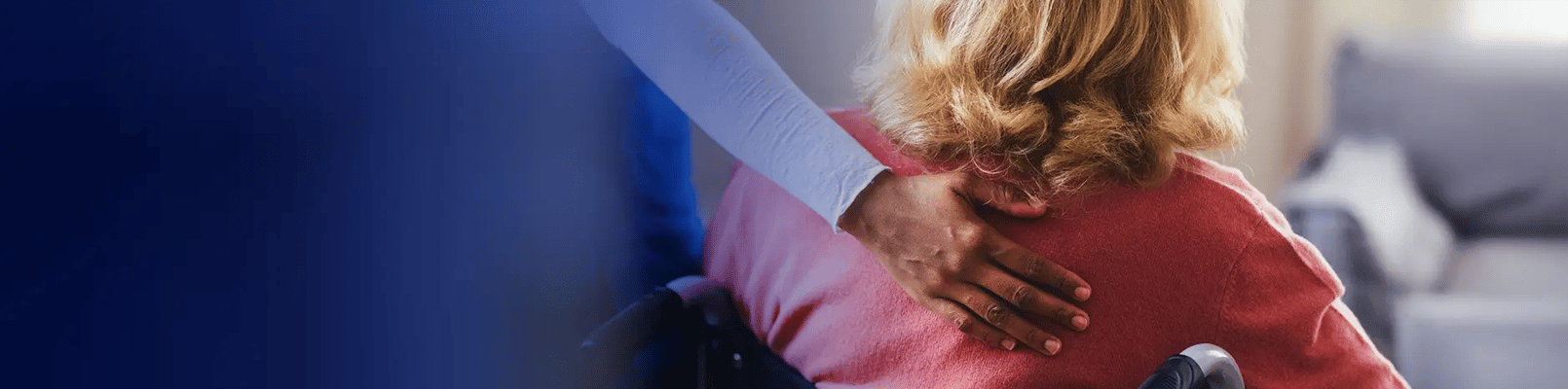 Caregiver assisting a resident in a cozy room